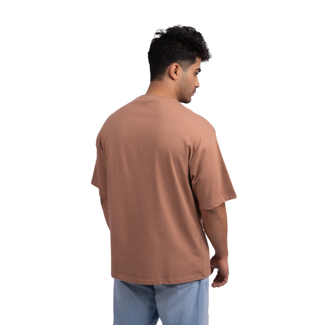 Driftwood brown oversized t-shirt angled view – warm-toned oversized tee with a timeless design for effortless layering.