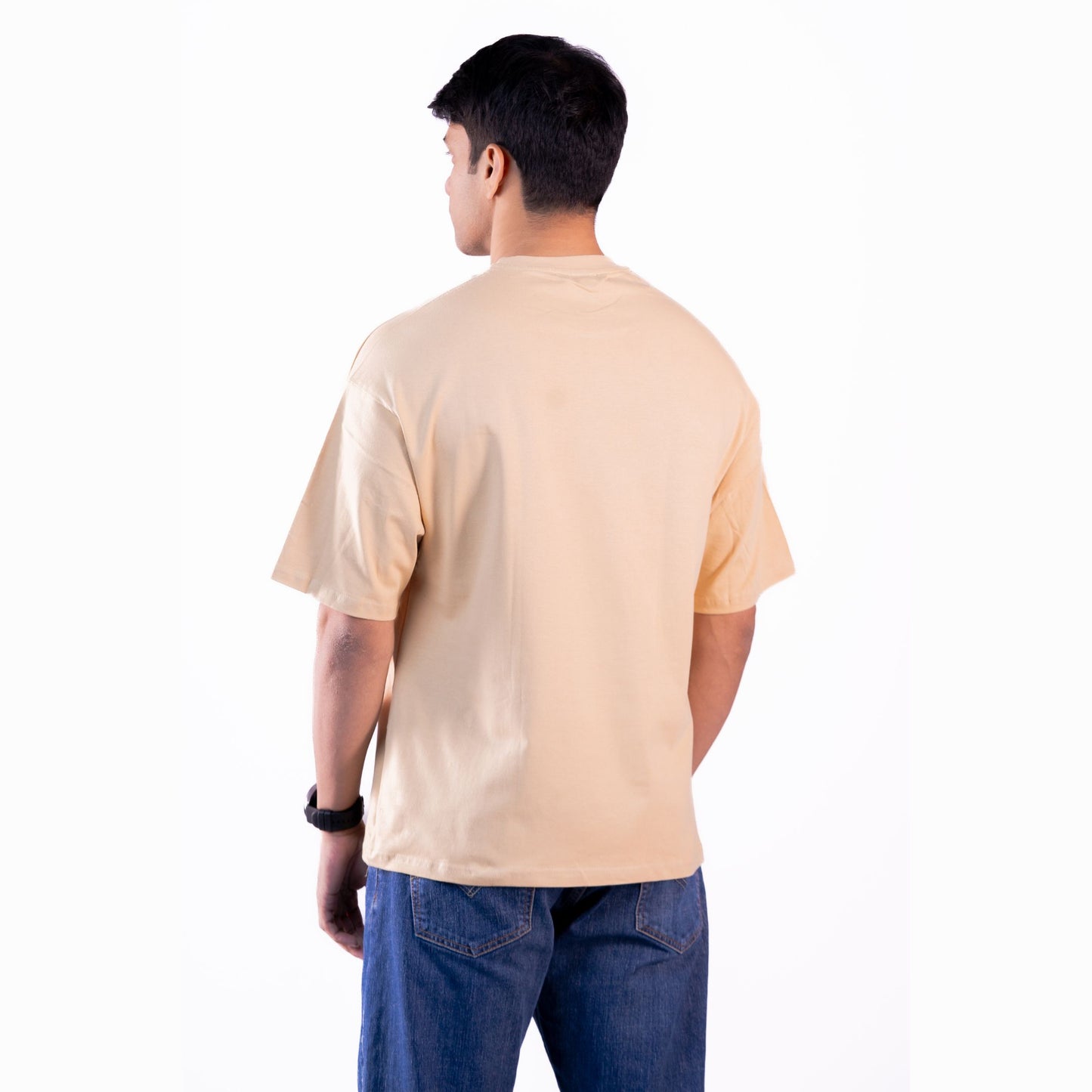 Neutral beige oversized t-shirt side view – relaxed fit, perfect for men and women.