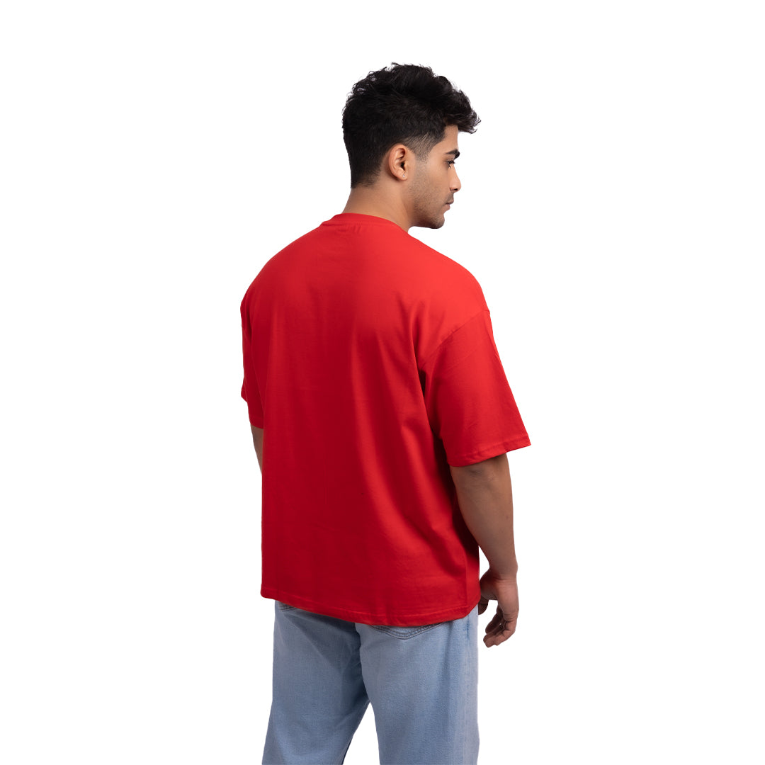 Red oversized t-shirt angled view – vibrant oversized tee designed for confident styling and everyday wear.