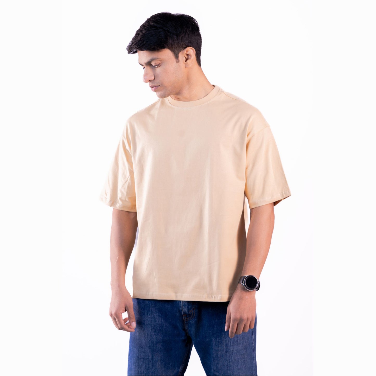 Unisex beige oversized t-shirt flatlay – soft, premium fabric with a modern oversized fit.