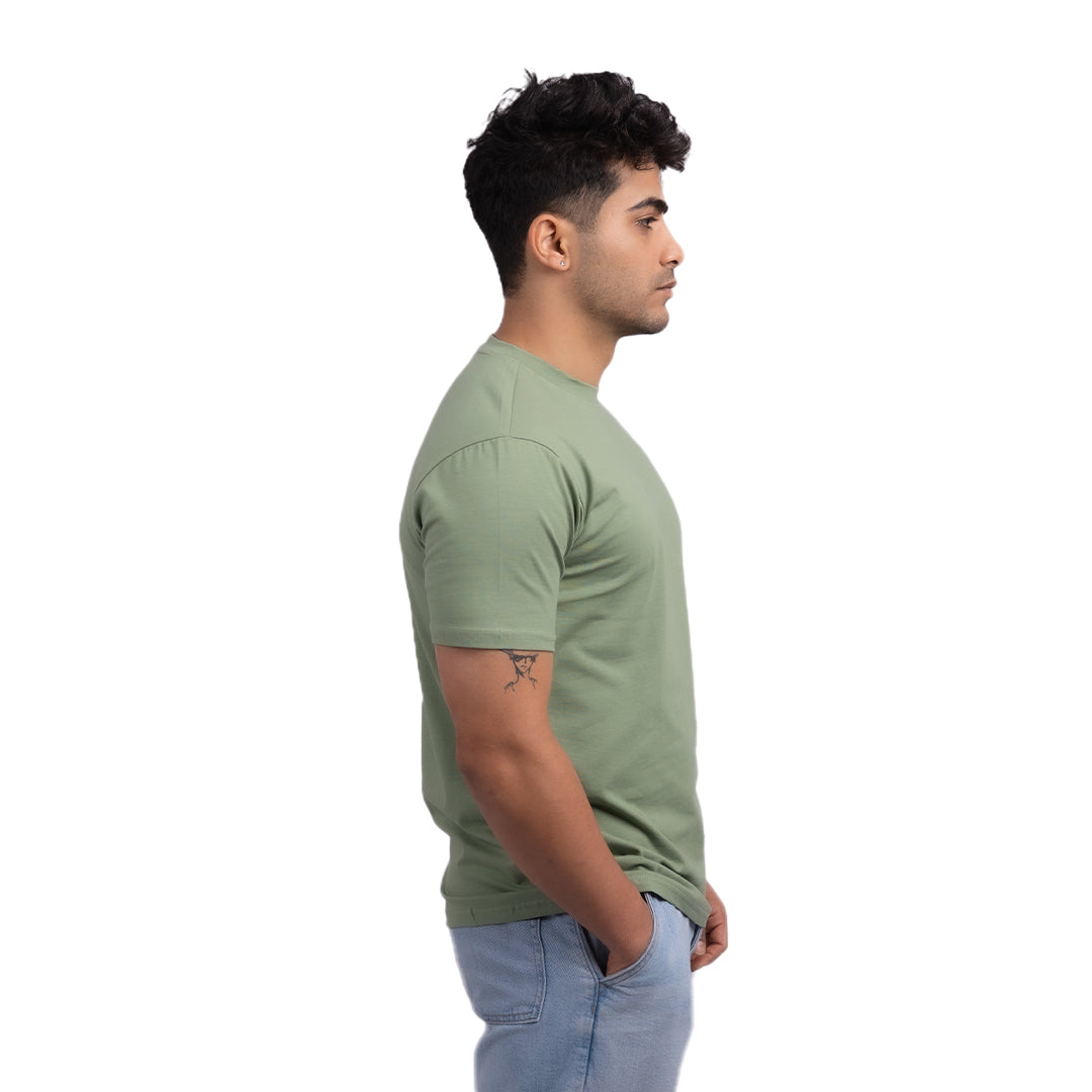 Teal cotton t-shirt side view – versatile regular-fit tee showcasing durable stitching and a clean silhouette.